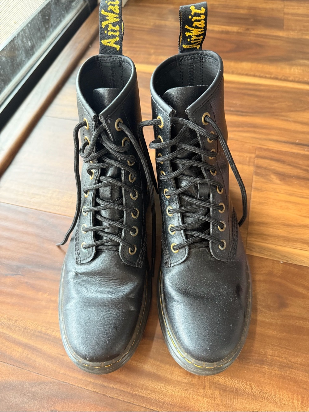 Dr. Martens Black Leather 8-Eye Lace-Up Boots with Yellow Heel Loop
